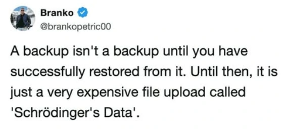 A social media post by @brankopetric00. "A backup isn't a backup until you have successfully restored from it. Until then, it's just a very expensive file upload called 'Schrödinger's Data'."