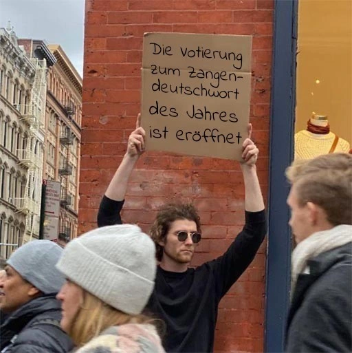 Person hält Pappschild hoch: Die Votierung zum Zangendeutschwort des Jahres ist eröffnet